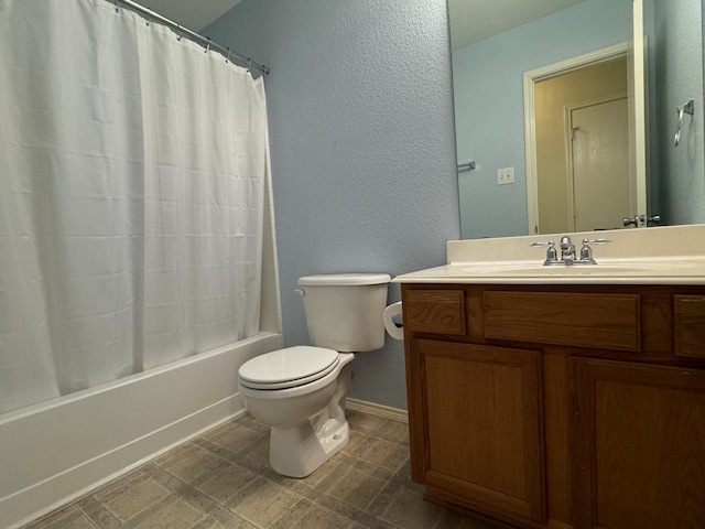 full bathroom with shower / bath combo, vanity, and toilet