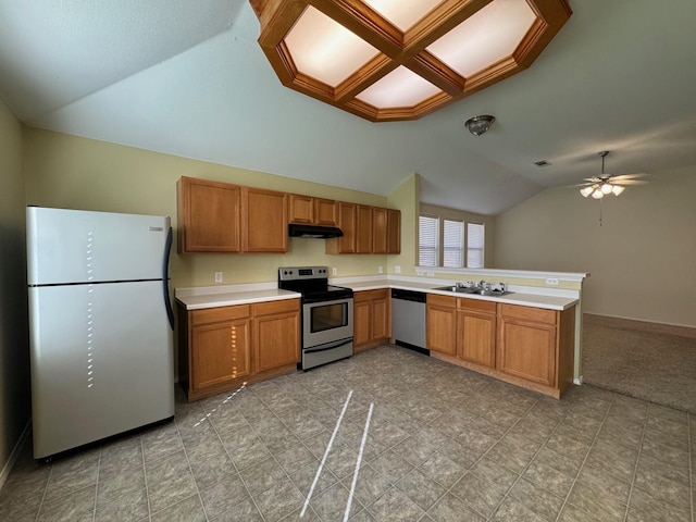 kitchen with sink, vaulted ceiling, ceiling fan, kitchen peninsula, and stainless steel appliances