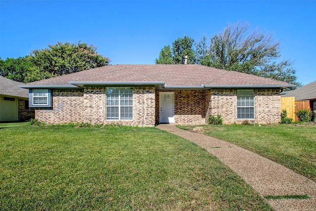 ranch-style house featuring a front lawn