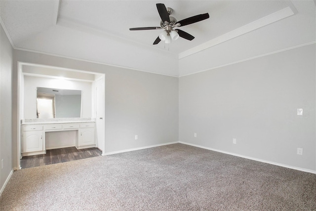 carpeted spare room featuring ornamental molding and ceiling fan