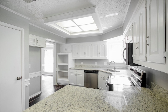 kitchen featuring appliances with stainless steel finishes, sink, white cabinets, ornamental molding, and dark wood-type flooring