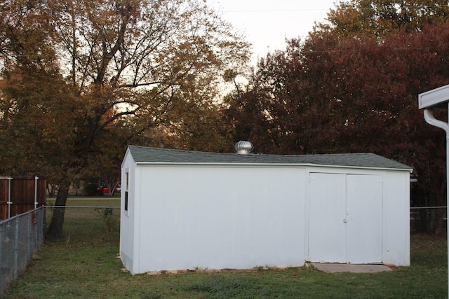 view of outdoor structure with a lawn