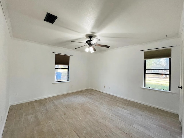 spare room featuring ornamental molding, light hardwood / wood-style floors, and ceiling fan