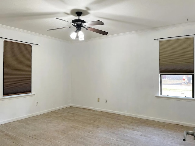 spare room with light hardwood / wood-style floors, ceiling fan, and crown molding