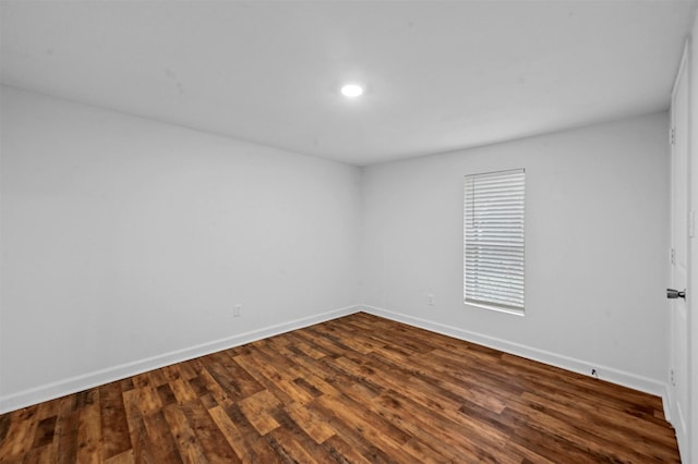 empty room with hardwood / wood-style floors