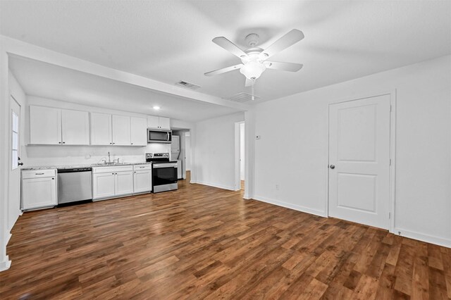 kitchen featuring ceiling fan, white cabinets, stainless steel appliances, and dark hardwood / wood-style floors