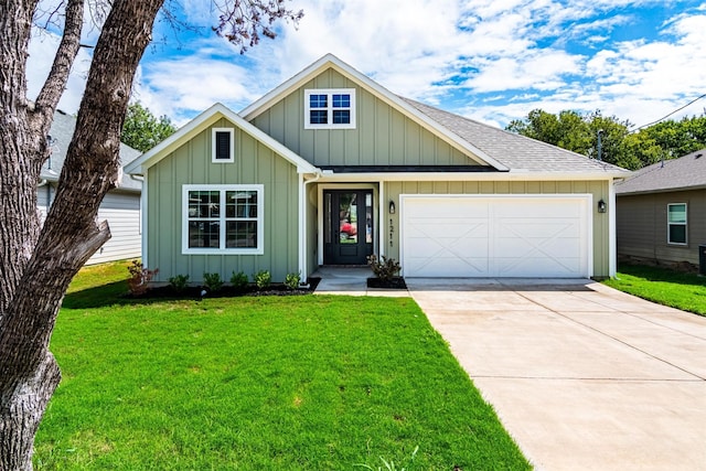 view of front of house featuring a garage and a front lawn