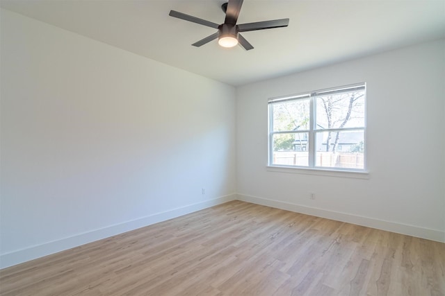 unfurnished room with light wood-type flooring and ceiling fan