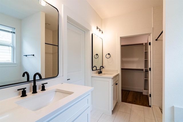 bathroom with tile patterned flooring and vanity