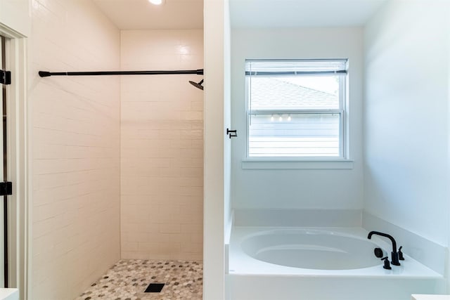 bathroom with separate shower and tub