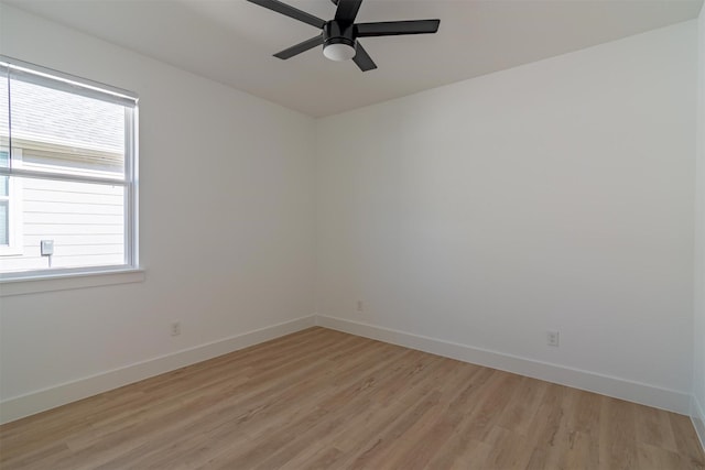 empty room featuring ceiling fan and light hardwood / wood-style floors