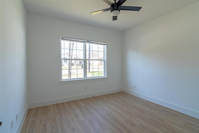 spare room featuring ceiling fan and light hardwood / wood-style flooring