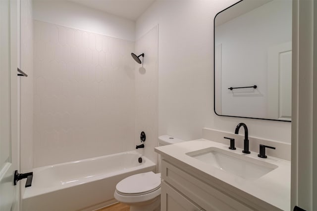 full bathroom with tiled shower / bath combo, toilet, and vanity