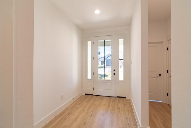 entryway with light hardwood / wood-style floors