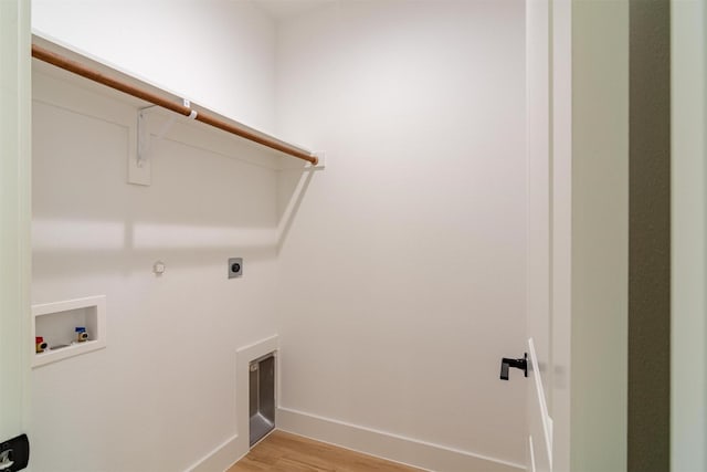 laundry room with washer hookup, hookup for a gas dryer, light hardwood / wood-style floors, and hookup for an electric dryer