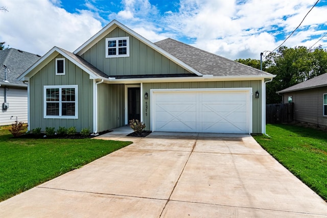 view of front of property featuring a garage and a front yard