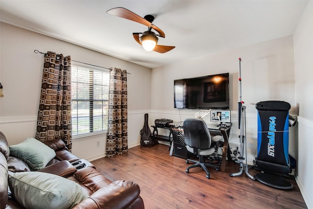 office featuring hardwood / wood-style floors and ceiling fan