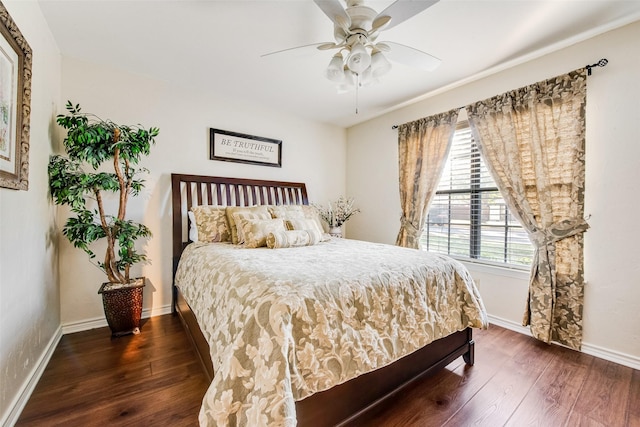 bedroom featuring ceiling fan and dark wood-type flooring