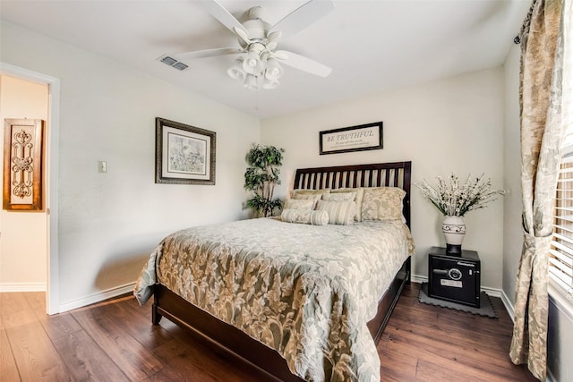 bedroom featuring ceiling fan and dark wood-type flooring