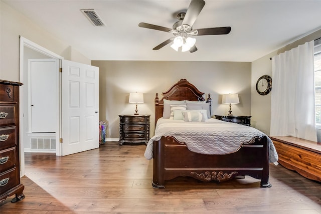 bedroom featuring hardwood / wood-style flooring and ceiling fan