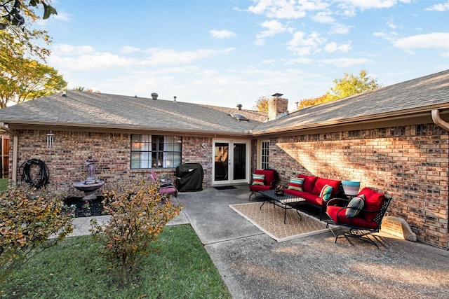 rear view of property with a patio and an outdoor hangout area