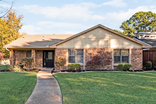 ranch-style home with a front lawn