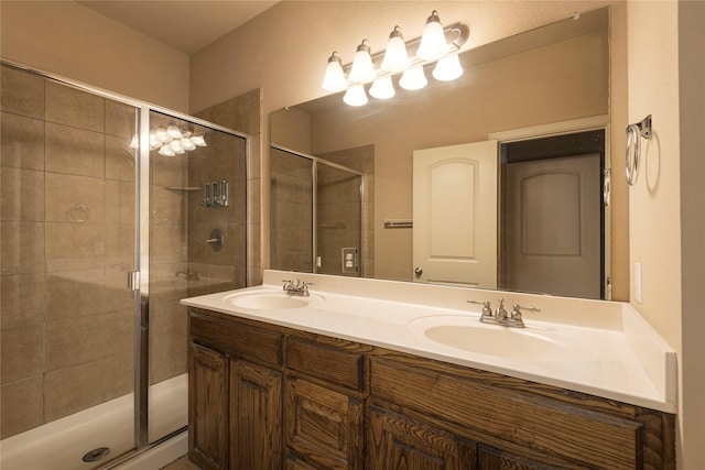 bathroom featuring an enclosed shower and vanity