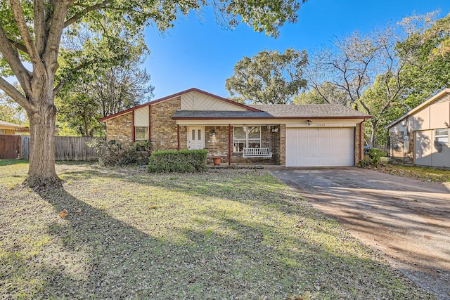 ranch-style house featuring a garage and a front lawn