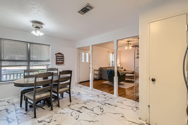 dining space featuring ceiling fan and light hardwood / wood-style floors