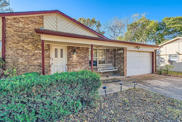 view of front of house with a garage and covered porch