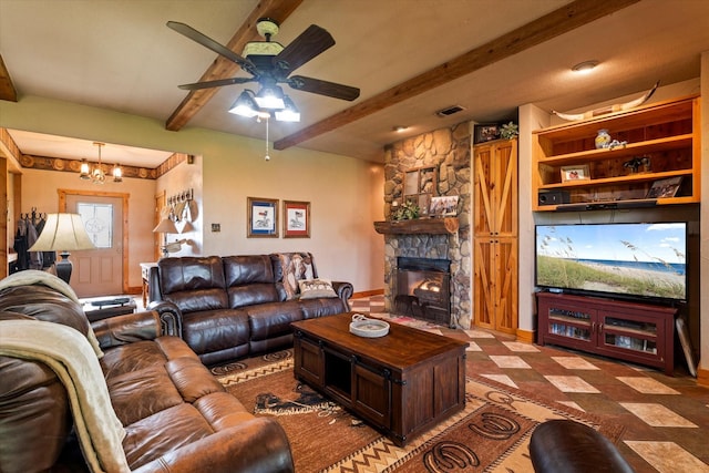 living room featuring a stone fireplace, ceiling fan with notable chandelier, and beamed ceiling