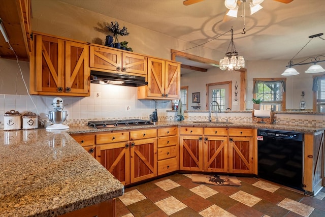 kitchen featuring pendant lighting, dishwasher, sink, and decorative backsplash