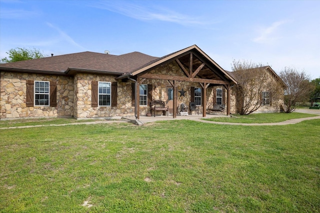 view of front of home featuring a patio and a front lawn