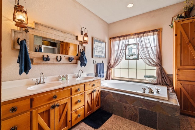 bathroom with vanity and tiled bath