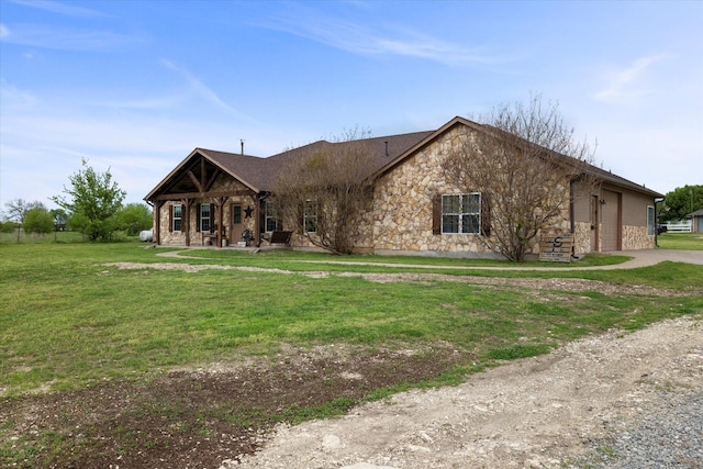 view of front of home with a garage and a front yard