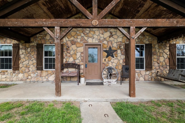 doorway to property with a patio area