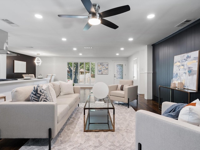 living room featuring ceiling fan and light hardwood / wood-style flooring