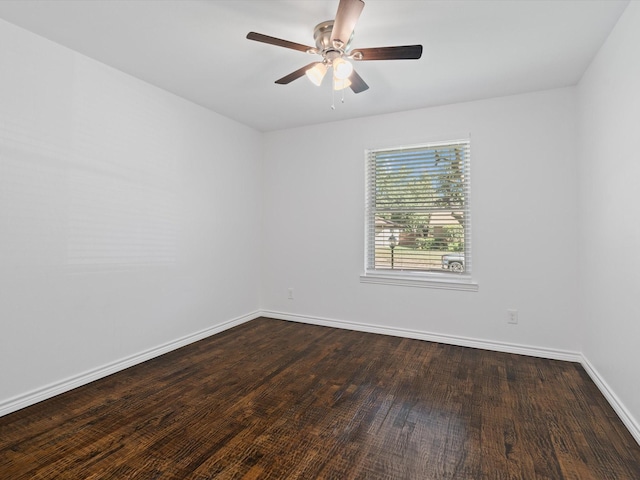 unfurnished room with ceiling fan and dark hardwood / wood-style flooring