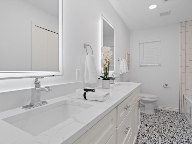 full bathroom with vanity, toilet, and washtub / shower combination