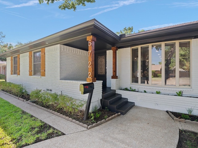 view of side of home with a porch