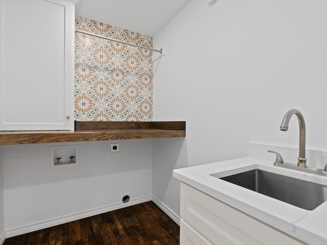 laundry room featuring sink, cabinets, electric dryer hookup, dark hardwood / wood-style flooring, and hookup for a washing machine