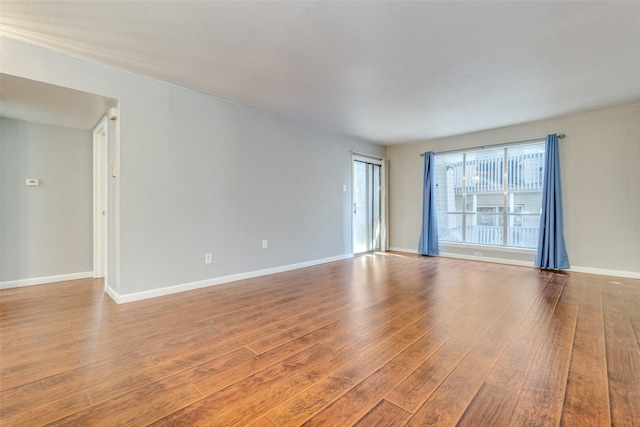 empty room featuring hardwood / wood-style flooring