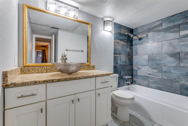 full bathroom with vanity, shower / bath combo, toilet, and a textured ceiling
