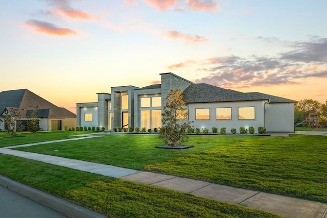 contemporary house featuring a lawn