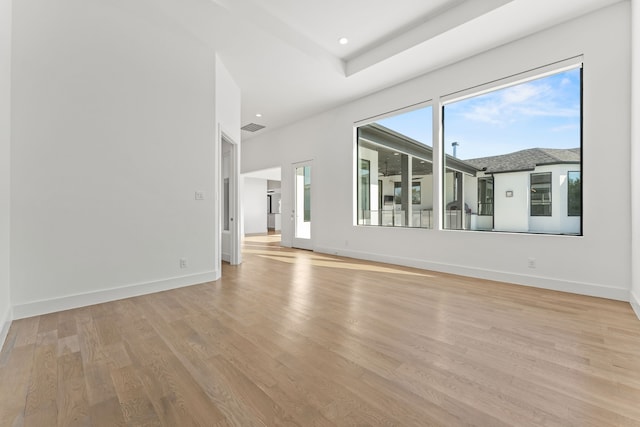 unfurnished living room with light hardwood / wood-style flooring