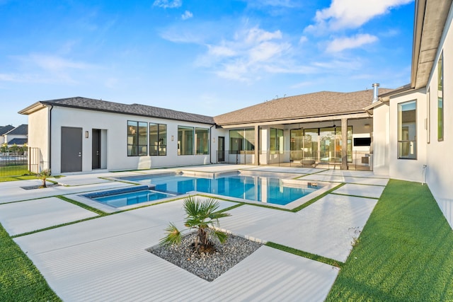 view of swimming pool with an in ground hot tub and a patio