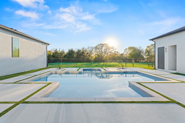 view of pool featuring a yard and an in ground hot tub