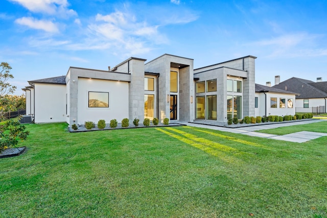 contemporary house with a front yard