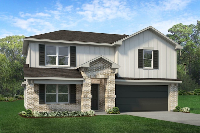 view of front of home with a front yard and a garage