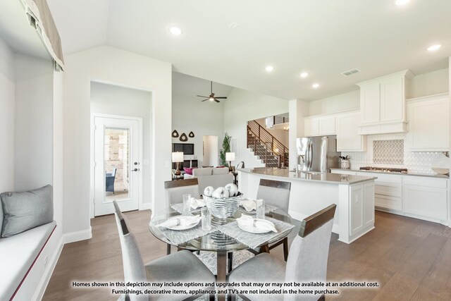 dining room with dark hardwood / wood-style flooring, sink, vaulted ceiling, and ceiling fan